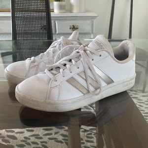 Classic Adidas with gold stripes. Super comfy for a casual fit.